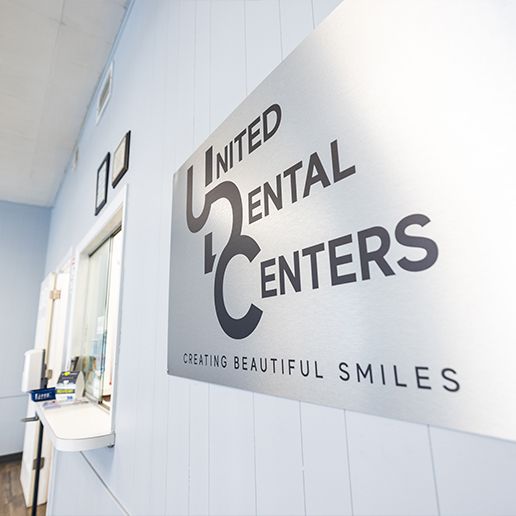 Sign reading United Dental Centers Creating Beautiful Smiles