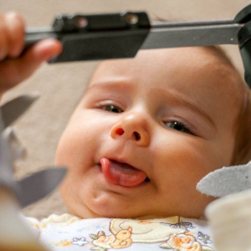 Baby sticking out their tongue