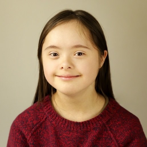 Young girl with special needs smiling