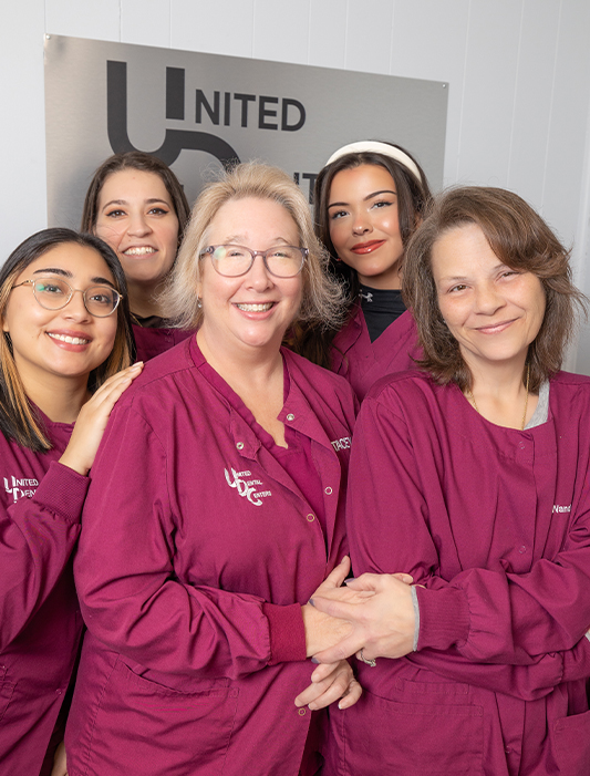 Smiling dental team members of cosmetic dentist in Whiting