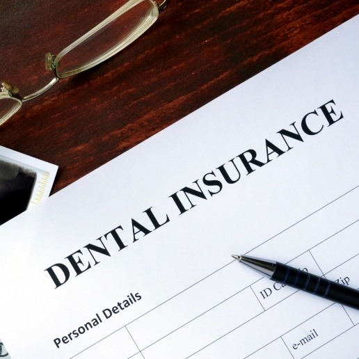 Dental insurance form on wooden table