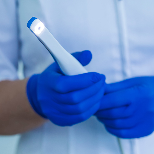 Dentist holding intraoral camera