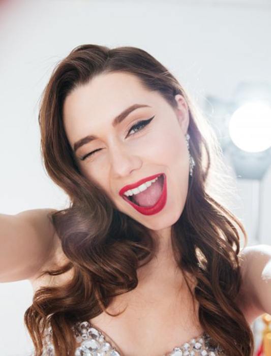 Woman smiling and winking at the camera