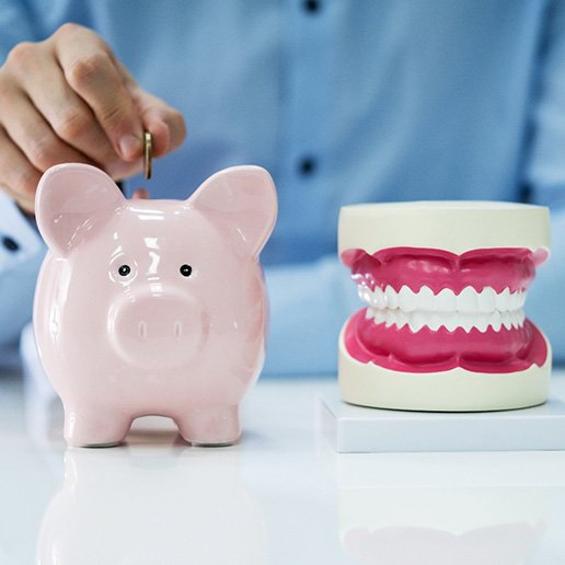 Whiting patient using piggy bank for smile makeover savings